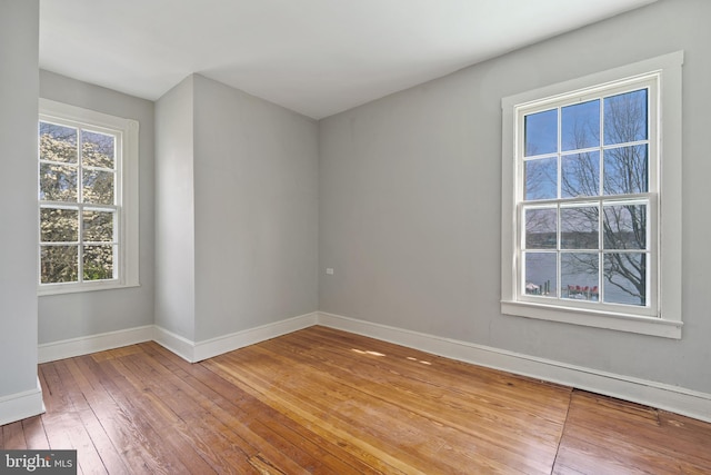 spare room featuring hardwood / wood-style floors