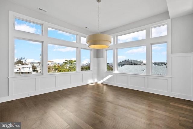 unfurnished sunroom with plenty of natural light