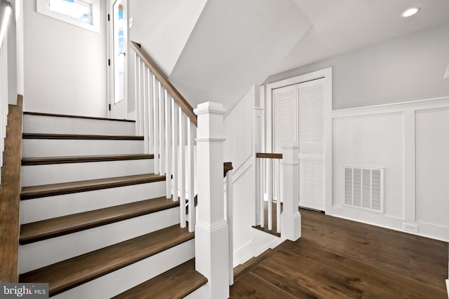 stairs with wood-type flooring