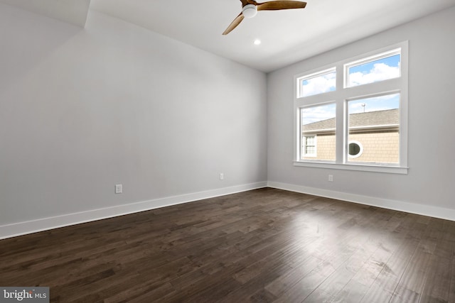 spare room featuring dark hardwood / wood-style floors, plenty of natural light, and ceiling fan