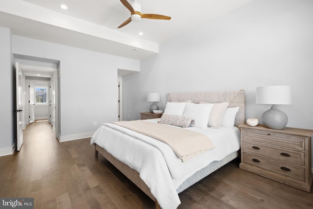 bedroom with ceiling fan and dark hardwood / wood-style flooring