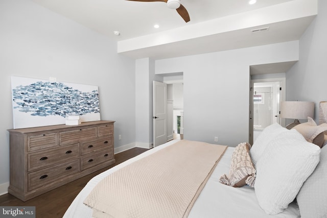 bedroom featuring ensuite bath, ceiling fan, and dark hardwood / wood-style flooring