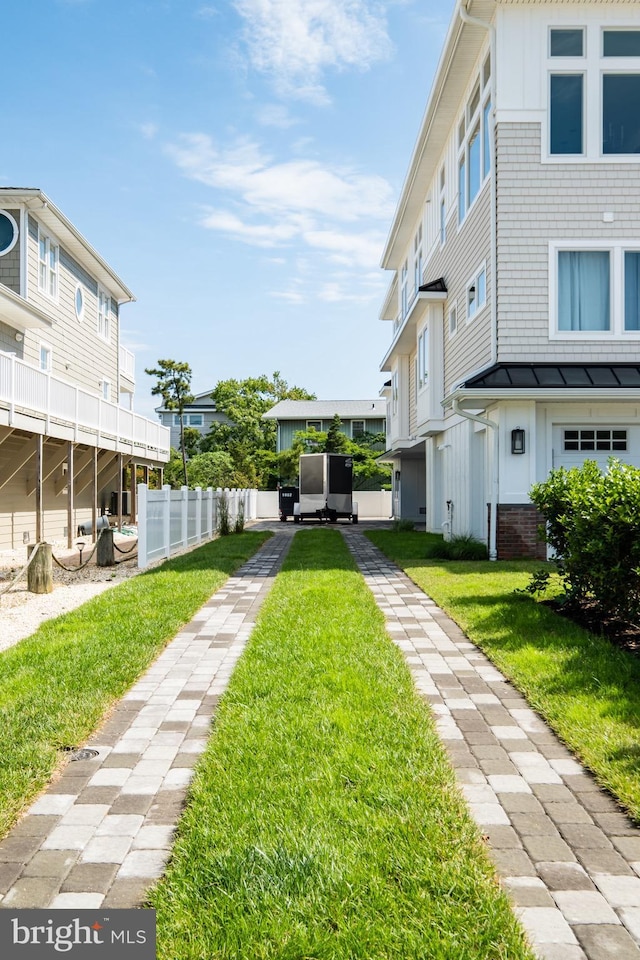 surrounding community featuring a yard