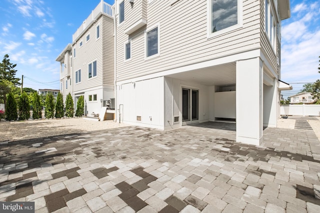 back of property with a patio area