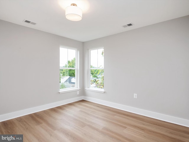 unfurnished room featuring light hardwood / wood-style flooring