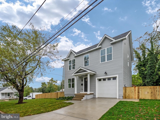 front of property featuring a front lawn and a garage