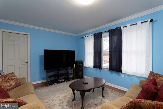 living room with crown molding and light hardwood / wood-style floors