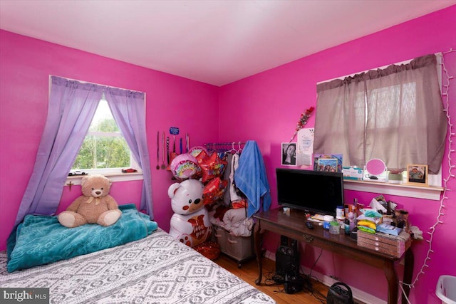 bedroom featuring wood-type flooring