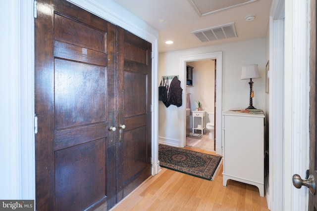 foyer with light hardwood / wood-style floors