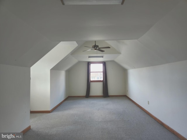 bonus room with light carpet, ceiling fan, and lofted ceiling