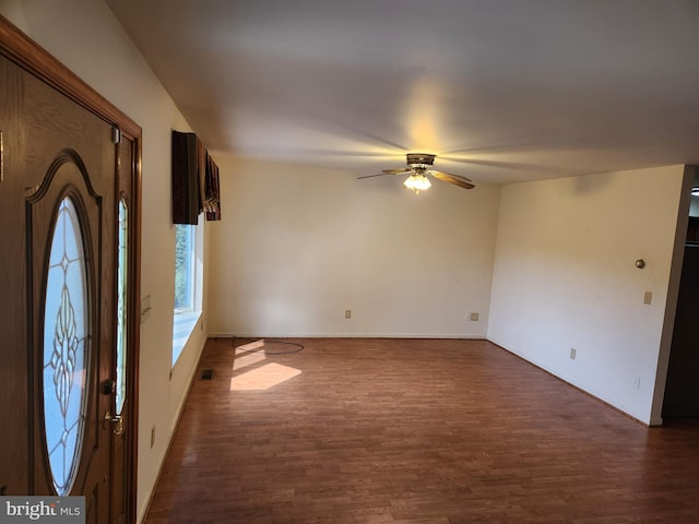 entryway with ceiling fan and dark hardwood / wood-style flooring