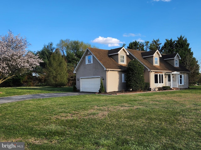 cape cod home featuring a front lawn and a garage