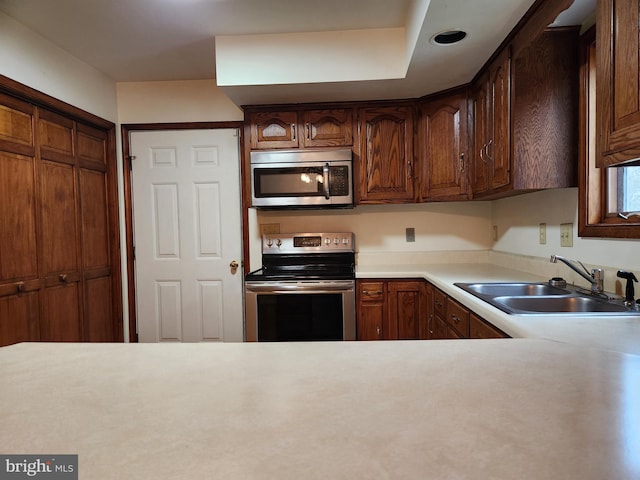 kitchen featuring stainless steel appliances and sink