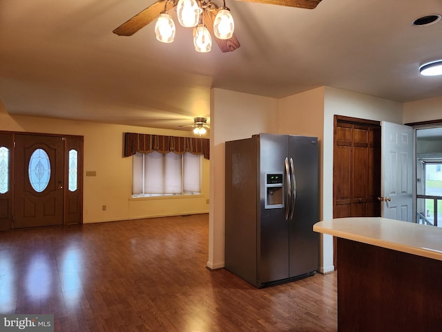 kitchen with dark hardwood / wood-style floors, ceiling fan, and stainless steel refrigerator with ice dispenser