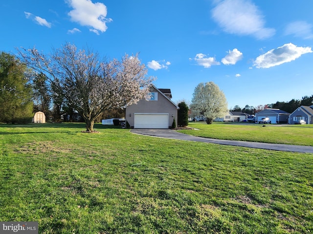 view of yard with a garage