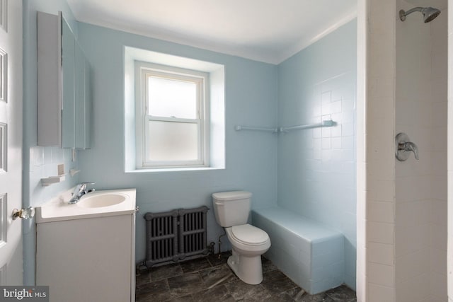 bathroom featuring vanity, tile flooring, radiator heating unit, and toilet