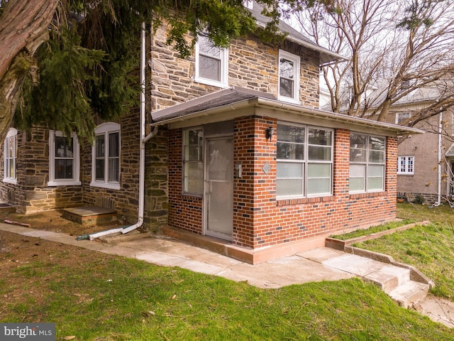 view of side of home featuring a yard