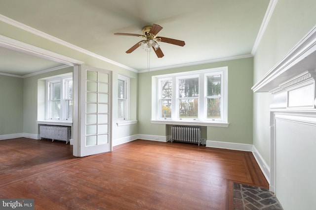 unfurnished living room featuring ceiling fan, dark hardwood / wood-style floors, and radiator heating unit