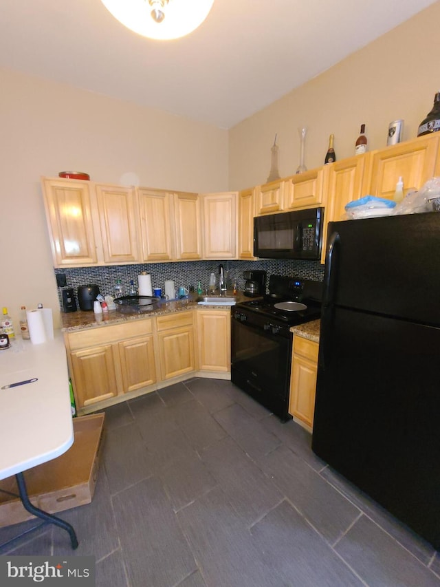 kitchen with black appliances, light brown cabinetry, sink, tasteful backsplash, and dark tile flooring