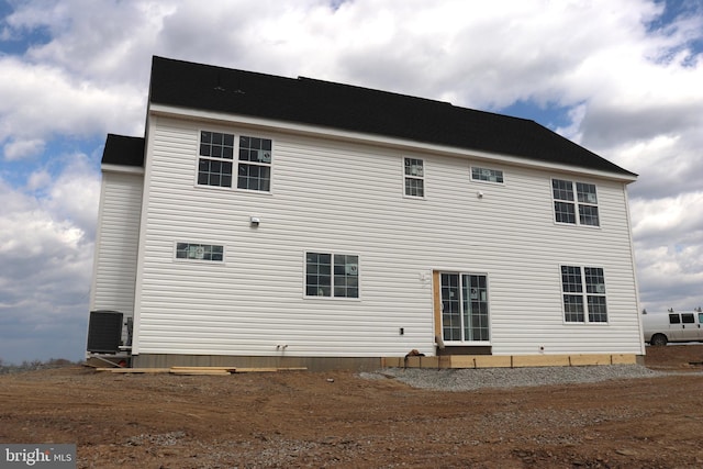 back of house featuring central AC