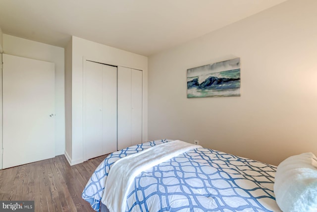 bedroom with a closet and light wood-type flooring