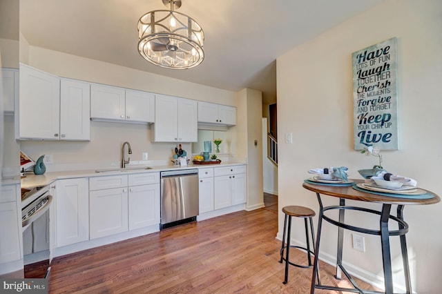 kitchen with light hardwood / wood-style flooring, white cabinetry, sink, and dishwasher