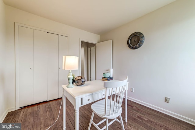 office space with dark wood-type flooring