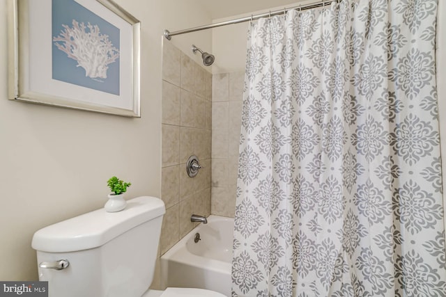 bathroom with toilet and shower / bathtub combination with curtain