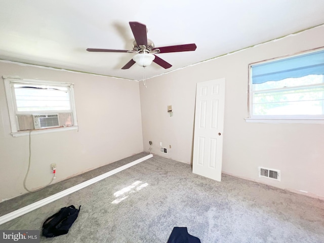 carpeted spare room with ceiling fan