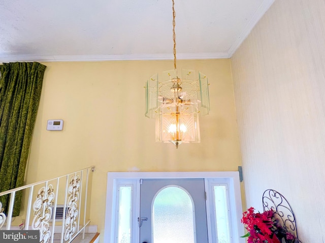 interior details featuring an inviting chandelier