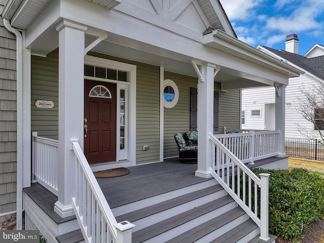 doorway to property featuring covered porch