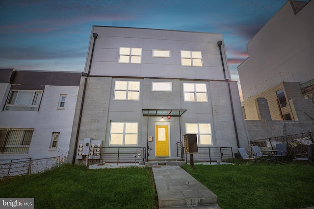 view of front of home with a yard