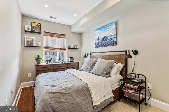 bedroom with hardwood / wood-style floors