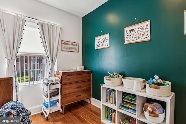 playroom with dark hardwood / wood-style flooring