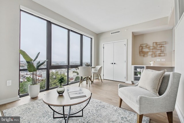 living area with light hardwood / wood-style flooring