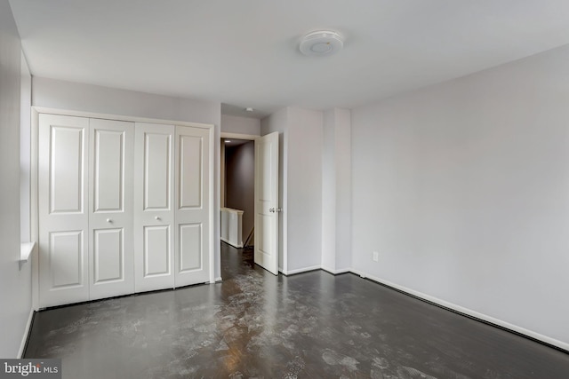 unfurnished bedroom with a closet