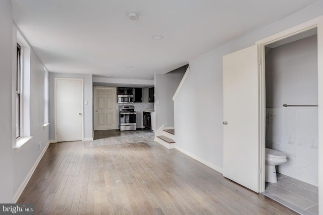 unfurnished living room featuring light wood-type flooring