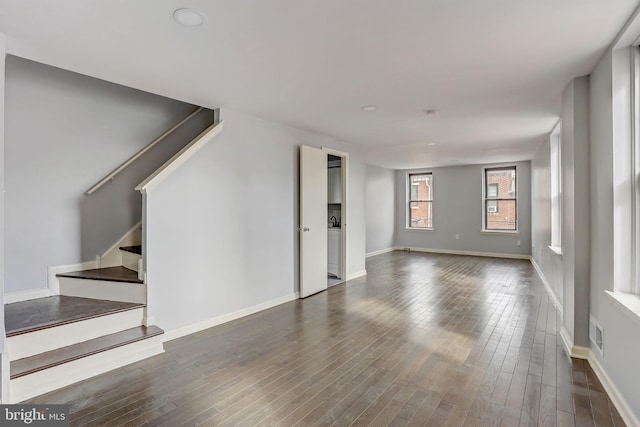 unfurnished room featuring dark hardwood / wood-style floors