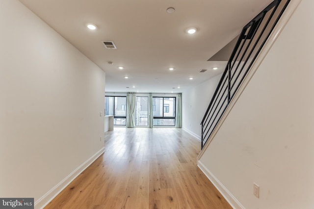 hall with light hardwood / wood-style flooring