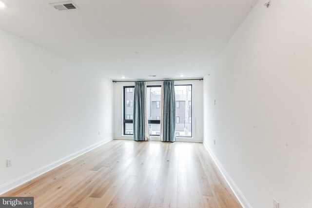 spare room with light hardwood / wood-style floors