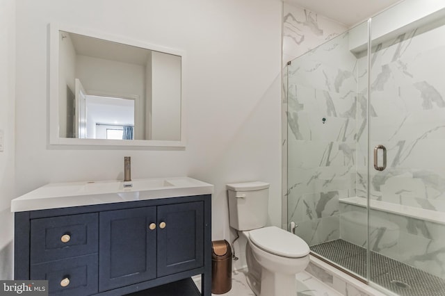 bathroom featuring an enclosed shower, toilet, and vanity