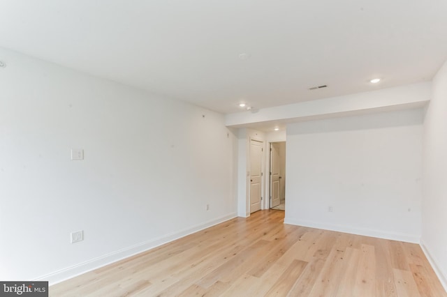 unfurnished room featuring light hardwood / wood-style floors