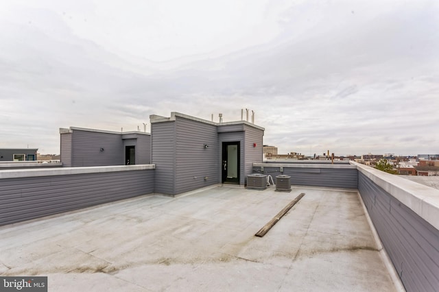 view of patio / terrace with a balcony and central air condition unit