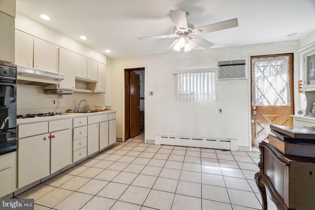 kitchen with a baseboard radiator, ceiling fan, white cabinets, and light tile flooring