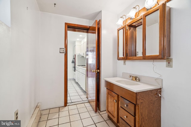 bathroom with vanity and tile flooring