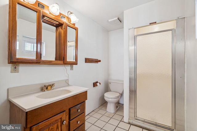 bathroom featuring a shower with shower door, tile floors, toilet, and vanity