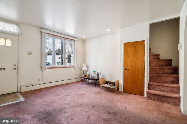 living area featuring a baseboard radiator and carpet floors