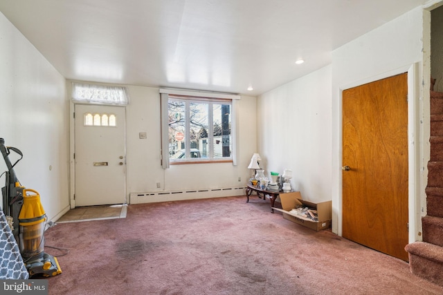 carpeted foyer featuring a baseboard radiator