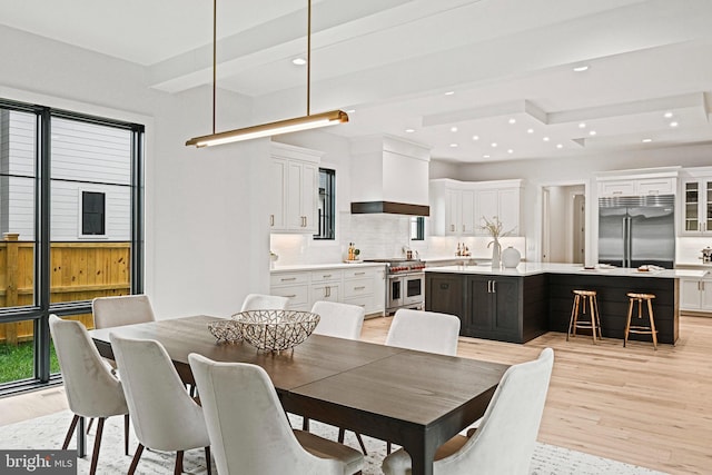 dining space featuring light hardwood / wood-style flooring