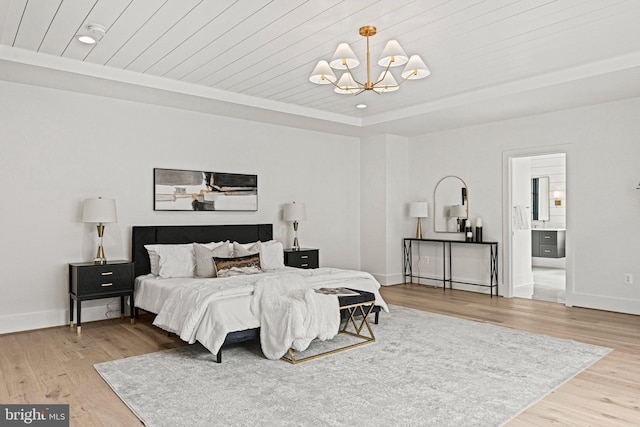 bedroom featuring an inviting chandelier, wood ceiling, ensuite bathroom, and light hardwood / wood-style floors